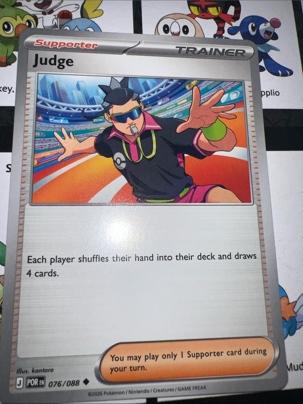 Pokemon Judge Supporter Card — orange, black, pink, green, silver